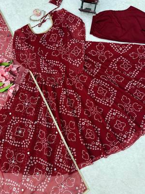 Women maroon bandhani print anarkali kurta with pent & dupatta 5