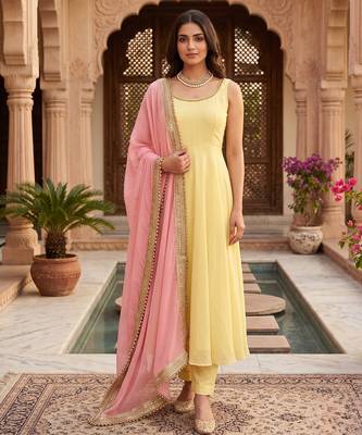 Women yellow anarkali kurta with yellow pant and pink dupatta 1