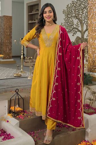 Women   s mustard yellow embroidered long flared kurta pant set with contrast pink border work dupatta
