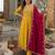 Women’s mustard yellow embroidered long flared kurta pant set with contrast pink border work dupatta