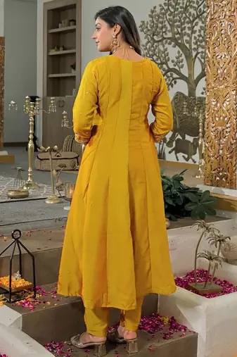Women   s mustard yellow embroidered long flared kurta pant set with contrast pink border work dupatta
