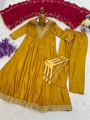 Women’s mustard yellow embroidered long flared kurta pant set with contrast pink border work dupatta 4