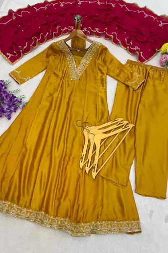 Women   s mustard yellow embroidered long flared kurta pant set with contrast pink border work dupatta