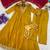 Women’s mustard yellow embroidered long flared kurta pant set with contrast pink border work dupatta