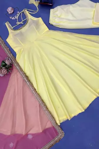 Women yellow anarkali kurta with yellow pant and pink dupatta