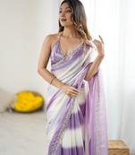 Lilac tissue satin embellished saree with unstitched blouse piece.