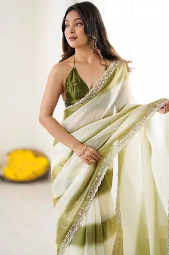 Olive tissue satin embellished saree with unstitched blouse piece.