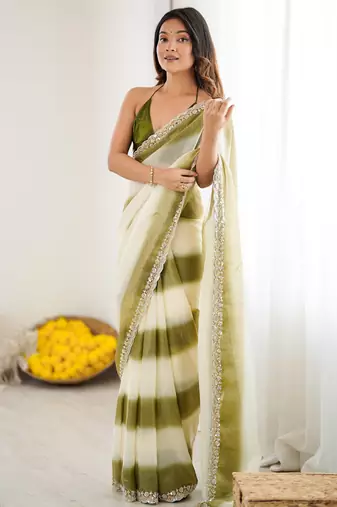 Olive tissue satin embellished saree with unstitched blouse piece.