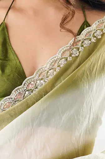 Olive tissue satin embellished saree with unstitched blouse piece.
