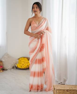 Peach tissue satin embellished saree with unstitched blouse piece. 2