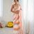 Peach tissue satin embellished saree with unstitched blouse piece.