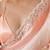 Peach tissue satin embellished saree with unstitched blouse piece.