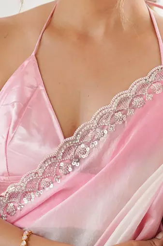 Pink tissue satin embellished saree with unstitched blouse piece.