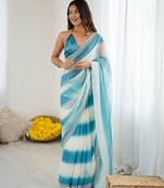 Sky blue tissue satin embellished saree with unstitched blouse piece.