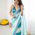 Sky blue tissue satin embellished saree with unstitched blouse piece.