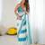 Sky blue tissue satin embellished saree with unstitched blouse piece.