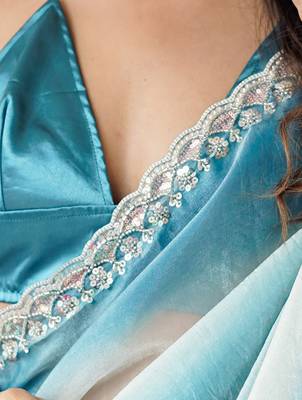 Sky blue tissue satin embellished saree with unstitched blouse piece. 4