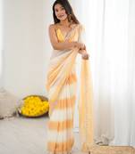 Yellow tissue satin embellished saree with unstitched blouse piece.