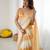 Yellow tissue satin embellished saree with unstitched blouse piece.