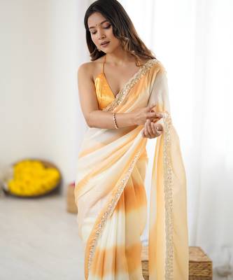 Yellow tissue satin embellished saree with unstitched blouse piece. 5