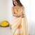 Yellow tissue satin embellished saree with unstitched blouse piece.