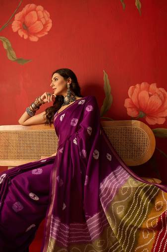 Purple silk cotton bandhni printed saree with unstitched blouse piece.