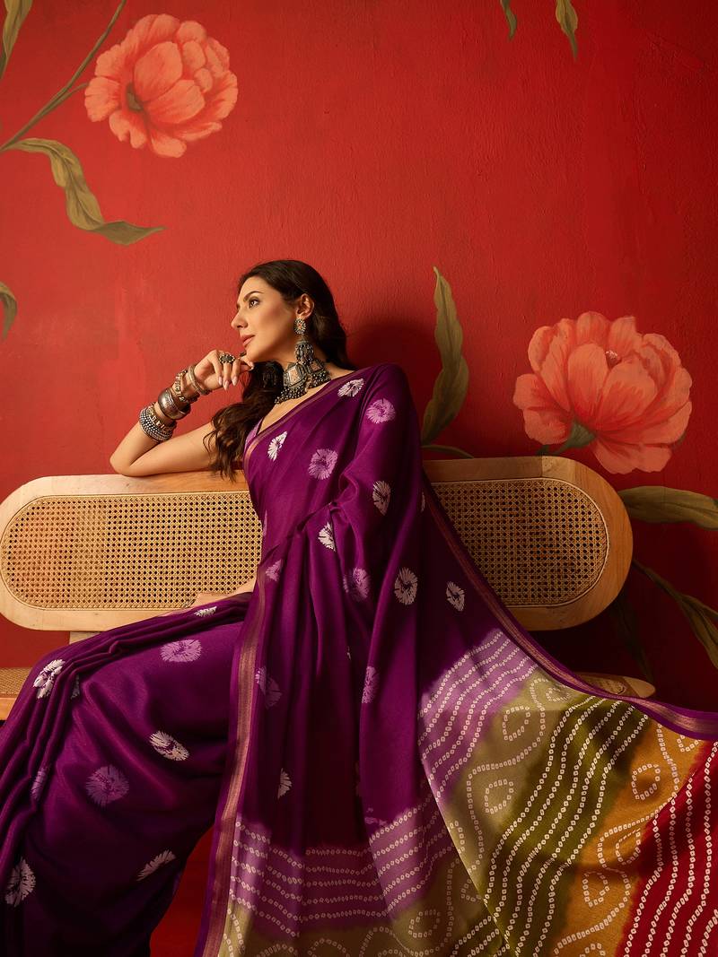 Purple silk cotton bandhni printed saree with unstitched blouse piece.