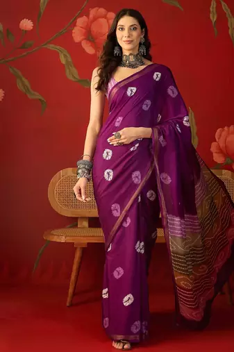 Purple silk cotton bandhni printed saree with unstitched blouse piece.
