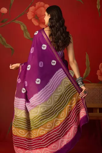 Purple silk cotton bandhni printed saree with unstitched blouse piece.