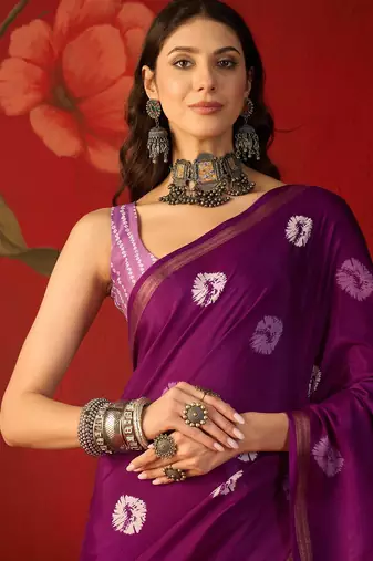 Purple silk cotton bandhni printed saree with unstitched blouse piece.