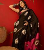 Black silk cotton bandhni printed saree with unstitched blouse piece.