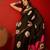 Black silk cotton bandhni printed saree with unstitched blouse piece.