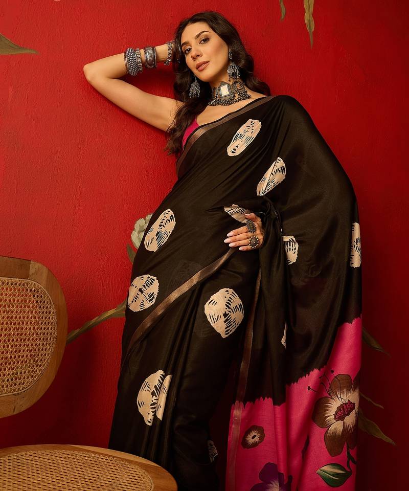 Black silk cotton bandhni printed saree with unstitched blouse piece.