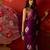 Purple silk cotton bandhni printed saree with unstitched blouse piece.