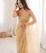 Chiku net embellished saree with unstitched blouse piece.