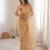 Chiku net embellished saree with unstitched blouse piece.
