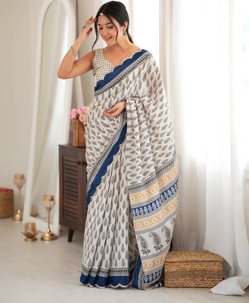 blue color tissue fabric smart printed saree with beautiful border work