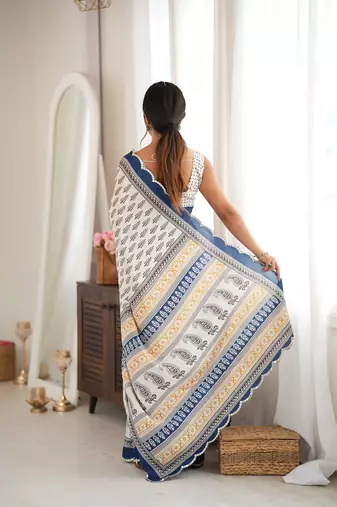 blue color tissue fabric smart printed saree with beautiful border work
