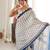 blue color tissue fabric smart printed saree with beautiful border work