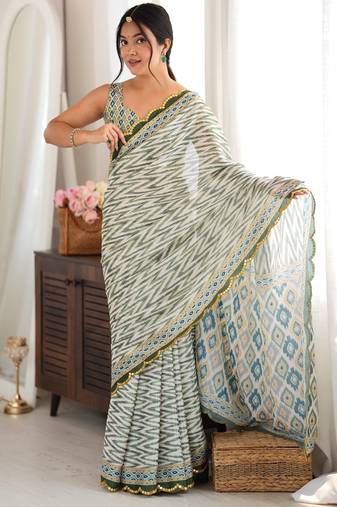 green color tissue fabric smart printed saree with beautiful border work