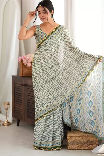 green color tissue fabric smart printed saree with beautiful border work