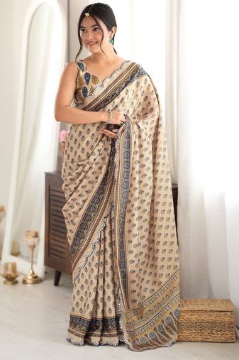 beige color tissue fabric smart printed saree with beautiful border work