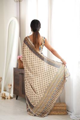 Beige color chinon fabric smart printed saree with beautiful border work 2
