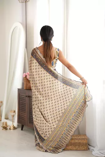 beige color tissue fabric smart printed saree with beautiful border work