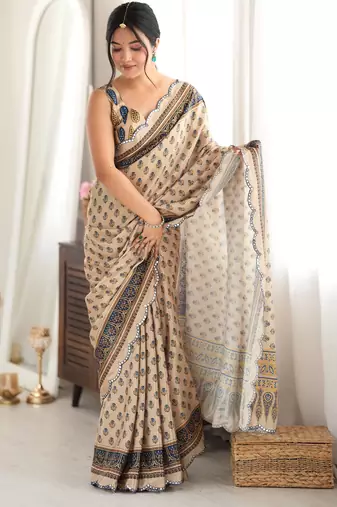 beige color tissue fabric smart printed saree with beautiful border work