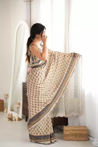 beige color tissue fabric smart printed saree with beautiful border work