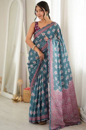 green color tissue fabric smart printed saree with beautiful border work
