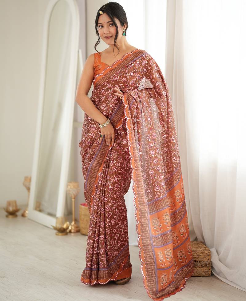 Orange color chinon fabric smart printed graceful looks saree