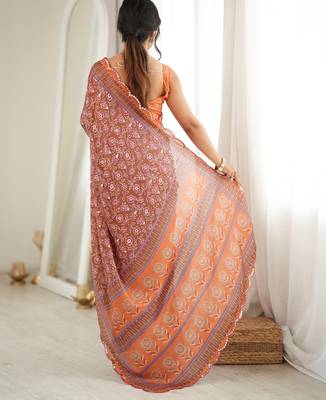 Orange color chinon fabric smart printed graceful looks saree 2