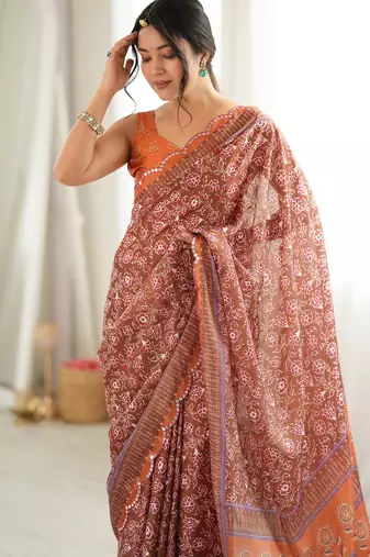 Orange color chinon fabric smart printed graceful looks saree